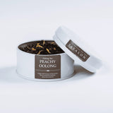 Peachy Oolong loose leaf tea in an open tin