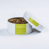 Genmaicha green loose leaf tea in an open tin