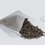 Earl Grey Reserve tea spilling out of a Soilon tea bag