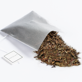 Great White tea spilling out of a Soilon tea bag