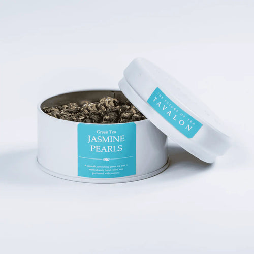 Jasmine Pearls green loose leaf tea in an open tin