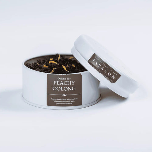 Peachy Oolong loose leaf tea in an open tin