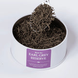Earl Grey Reserve black loose leaf tea with a teaspoon
