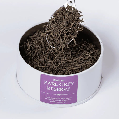 Earl Grey Reserve black loose leaf tea with a teaspoon