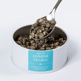 Jasmine Pearls green loose leaf tea with a teaspoon