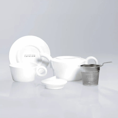 A Tavalon Rondi for One set from teaware sets by Tavalon, including a white porcelain teacup, saucer, teapot, and stainless steel infuser.