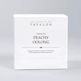 Tavalon Peachy Oolong tea packaging on a gray background