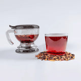 One of the Tavalon Ultimate Crimson Punch Bundle tea gift sets, including Tavalon Gravity Teapot, Tavalon Mug, and Crimson Punch loose leaf tea