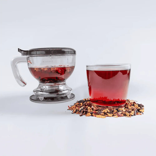 One of the Tavalon Ultimate Crimson Punch Bundle tea gift sets, including Tavalon Gravity Teapot, Tavalon Mug, and Crimson Punch loose leaf tea